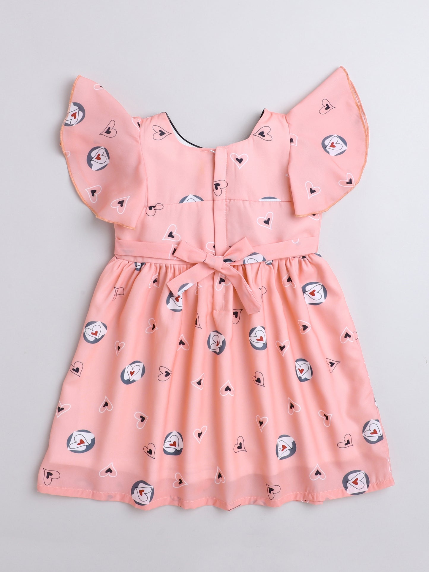 Heart Printed Flutter Sleeve Dress With Bow For Girls-Peach