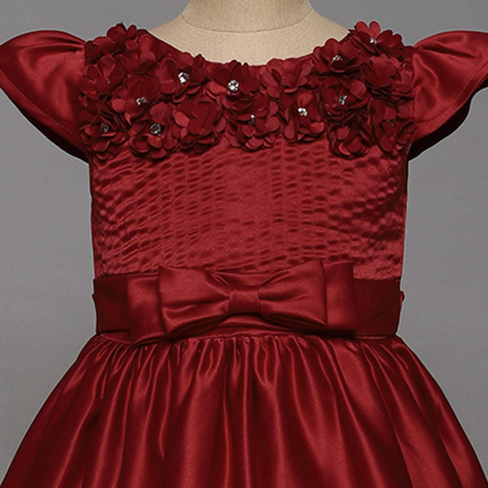 The Magic Wand Solid Satin Cap Sleeves Flower Embelished Party Dress For Girls With Bow Maroon
