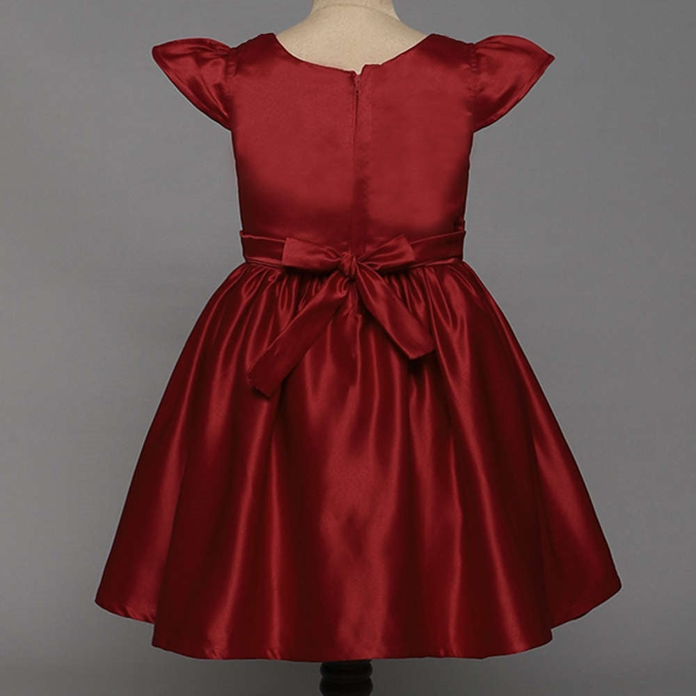 The Magic Wand Solid Satin Cap Sleeves Flower Embelished Party Dress For Girls With Bow Maroon