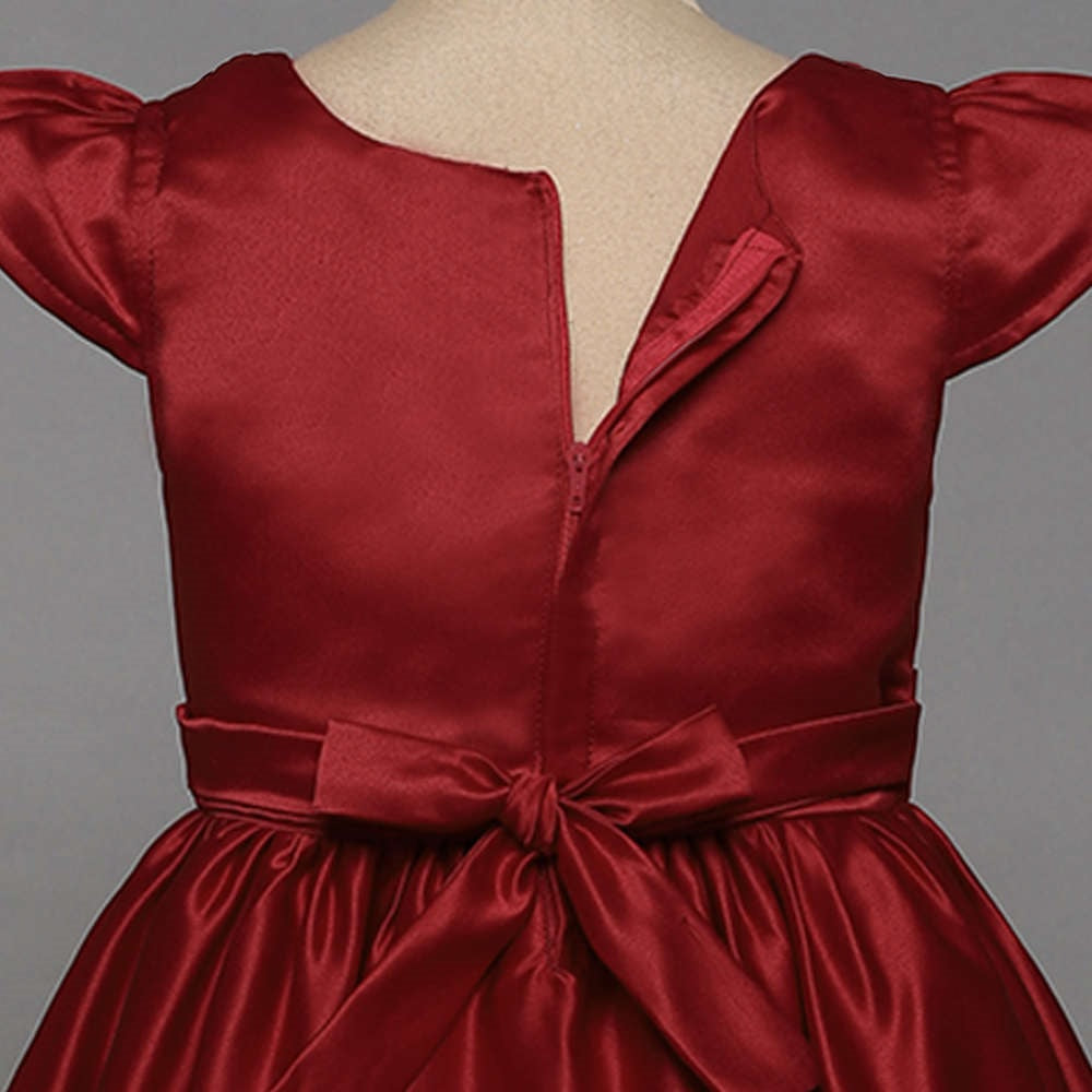 The Magic Wand Solid Satin Cap Sleeves Flower Embelished Party Dress For Girls With Bow Maroon