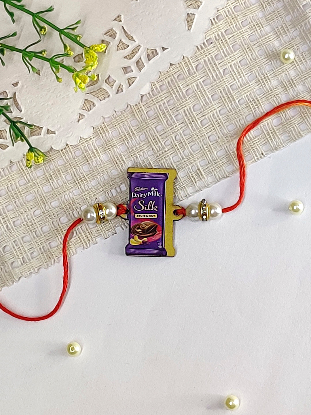 The Magic Wand Trendy Quirky Dairy Milk Silk Wooden Rakhi- Multi