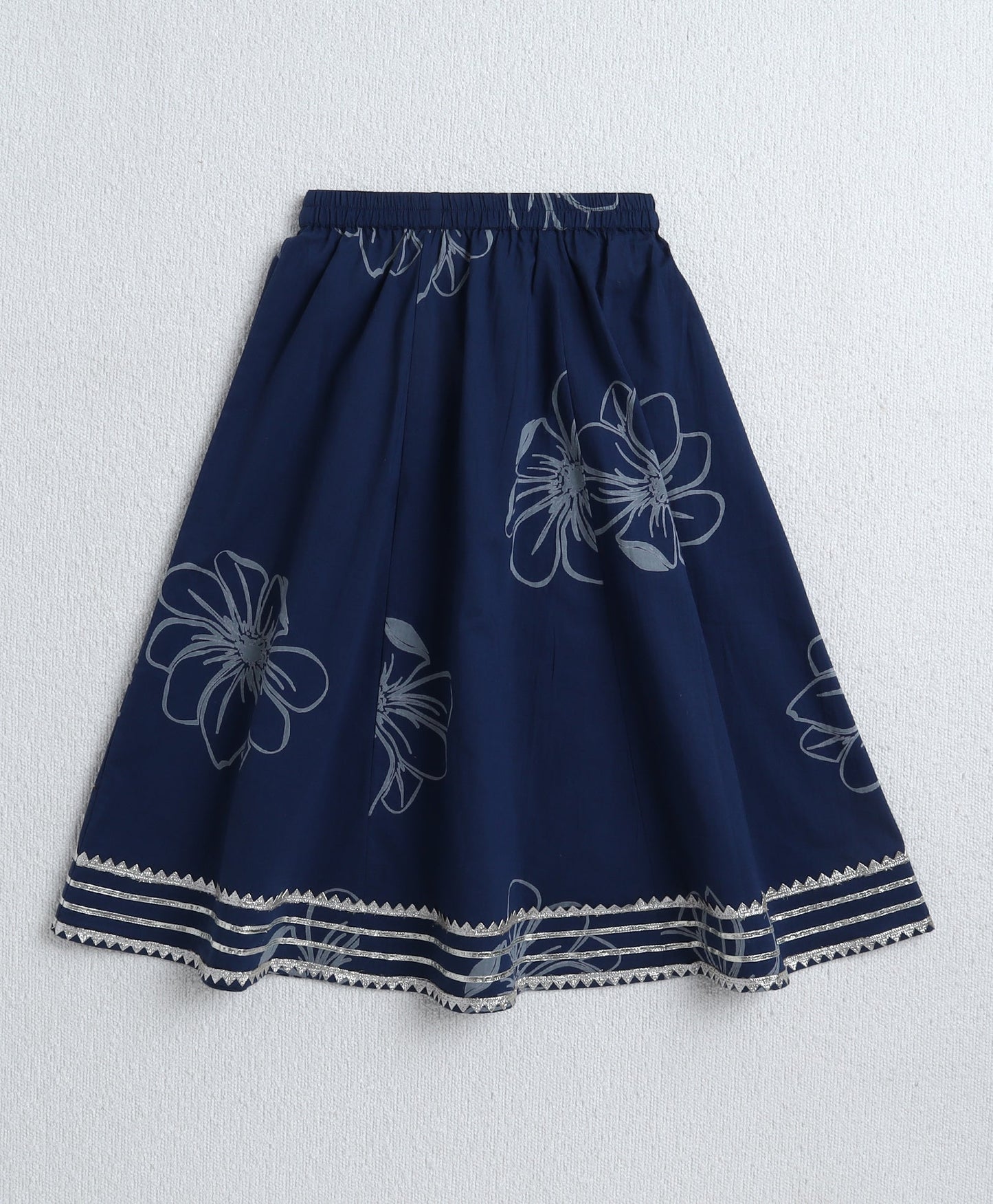 The Magic Wand Cambric Cotton Sleeveless Floral Printed Lace Detailing Frill Choli and Lehenga Set- Blue