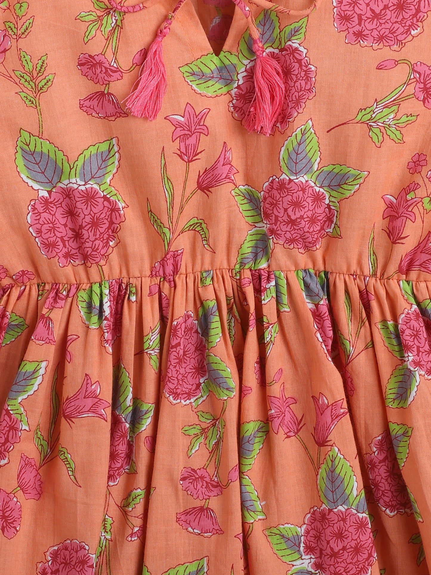 Floral Printed Cotton Three Fouth Sleeves Gathered Round Neck Top With Tassels - Peach