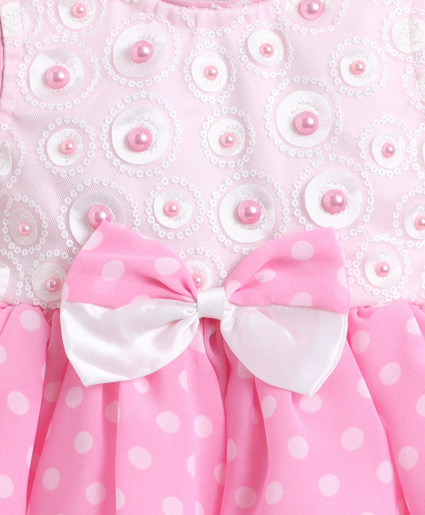 The Magic Wand Woven Sleeveless Polka Dot Pearl Embellished Flared Dress With Bow Applique - Pink