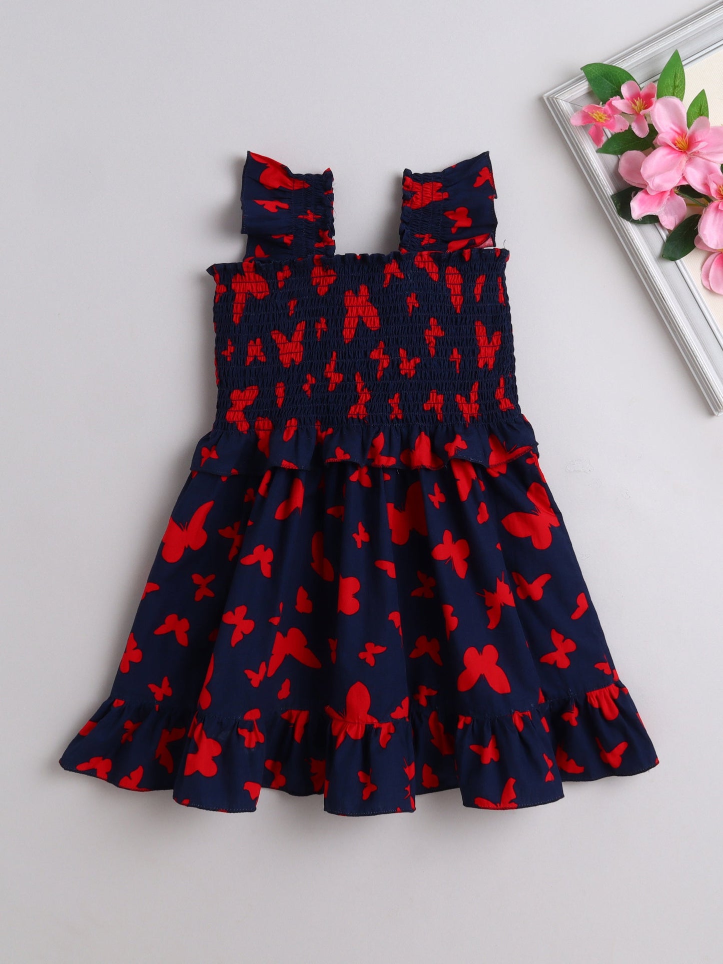 The Magic Wand Sleeveless Smoke Detail Butterfly Printed Frill Dress -Navy Blue
