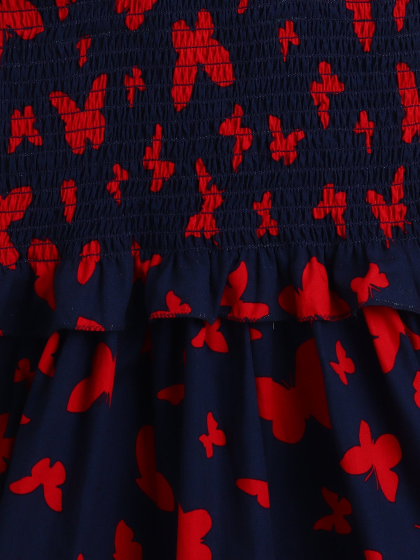 The Magic Wand Sleeveless Smoke Detail Butterfly Printed Frill Dress -Navy Blue