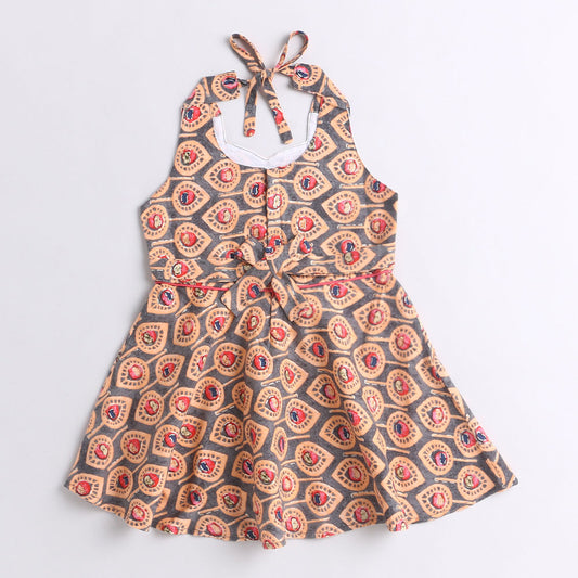 Halter Neck Printed Rayon Flared Hem Dress With Dangler Tassel -Peach