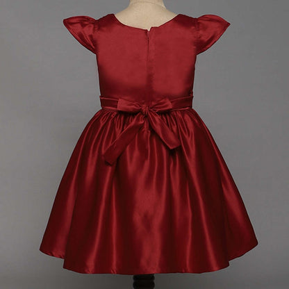 The Magic Wand Solid Satin Cap Sleeves Flower Embelished Party Dress For Girls With Bow Maroon