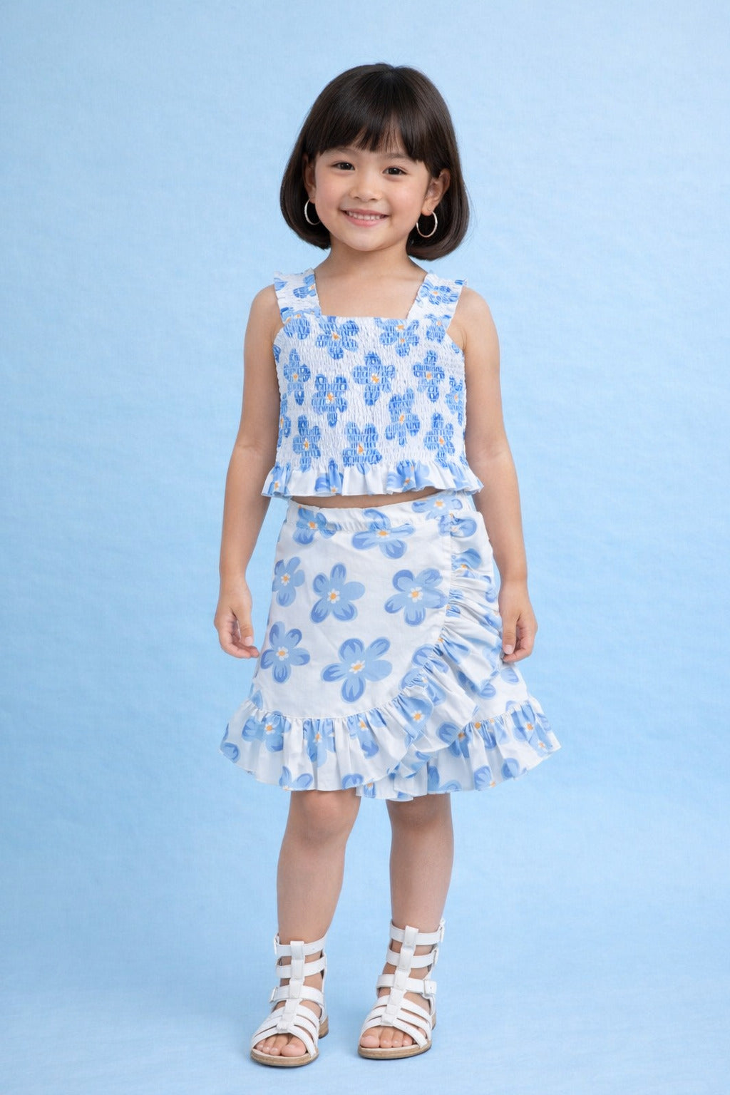 The Magic Wand Cotton Woven Sleeveless Floral Printed Smocked Top And Wrap Frill Skirt - Blue