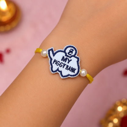 The Magic Wand Cute My Piggy Bank Rakhi - White