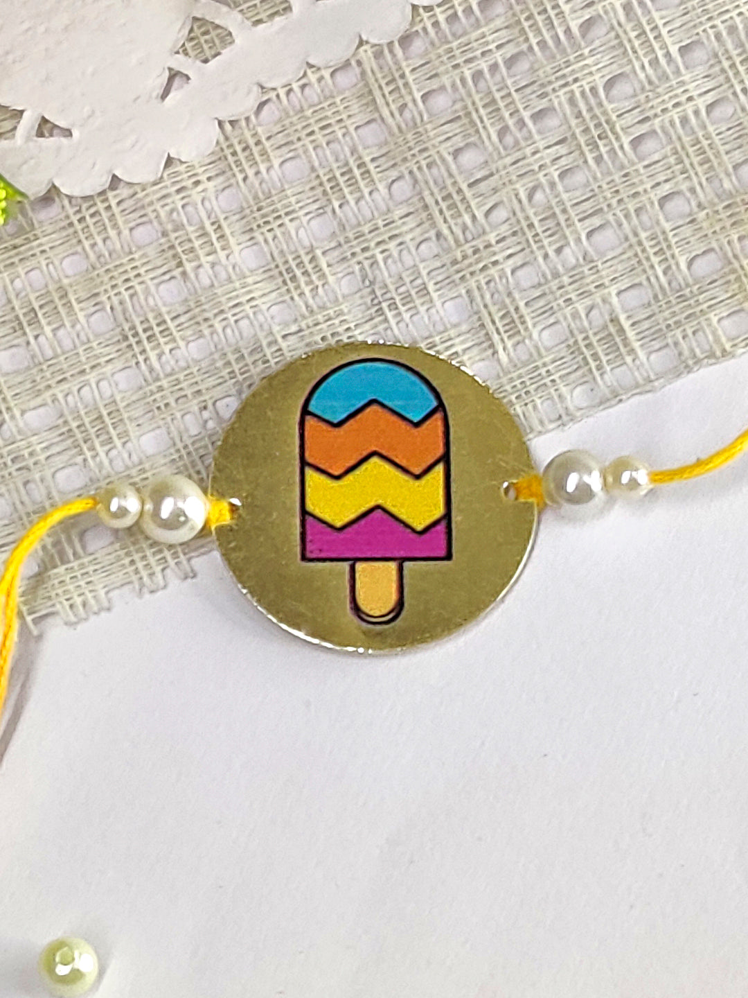 The Magic Wand Ice Candy Printed Rakhi With Pearls - Multi Colour