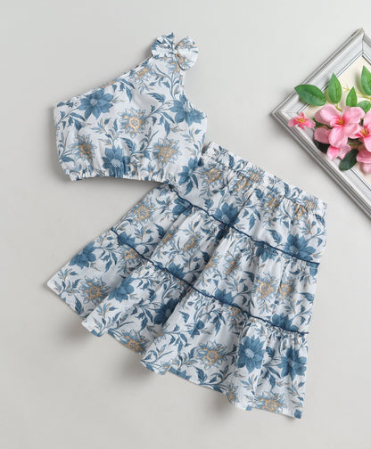 The Magic Wand Cotton Woven One Shoulder Bow Detailed Floral Printed Top With Tiered Skirt Set - Blue