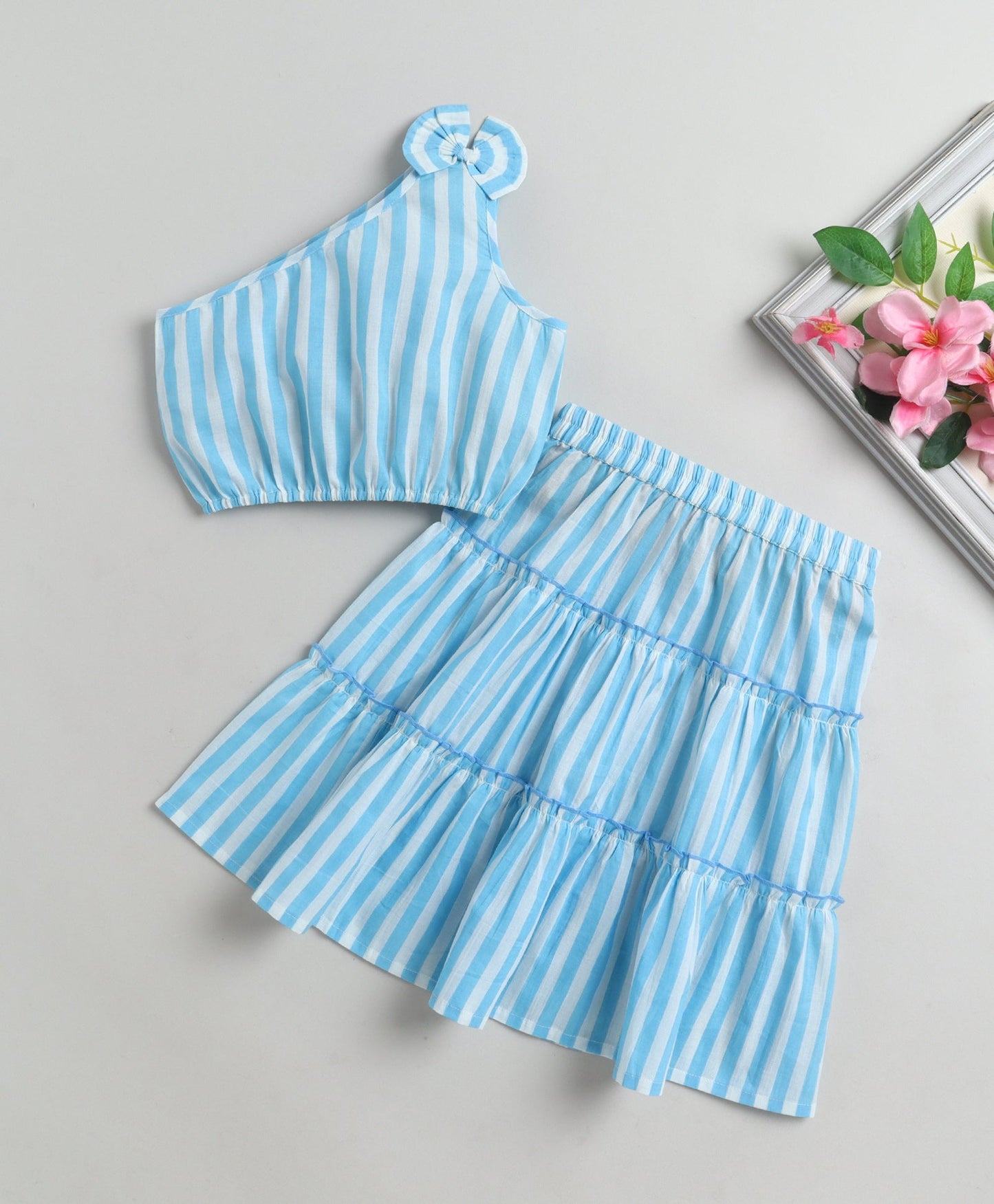 The Magic Wand Cotton Woven One Shoulder Bow Detailed Stripped Printed Top With Tiered Skirt Set -Sky Blue