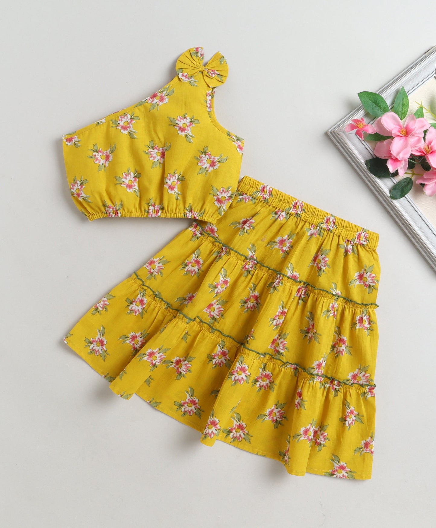 The Magic Wand Cotton Woven One Shoulder Bow Detailed Floral Printed Top With Tiered Skirt Set - Yellow