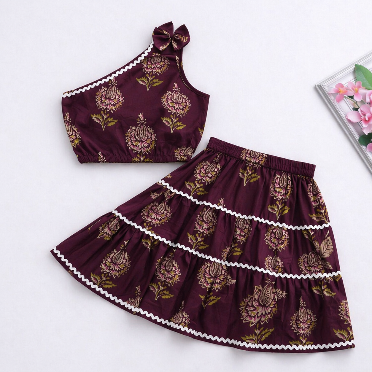 The Magic Wand Cambric Cotton Woven One Shoulder Floral Printed Laced Top And Tiered Skirt Set - Wine