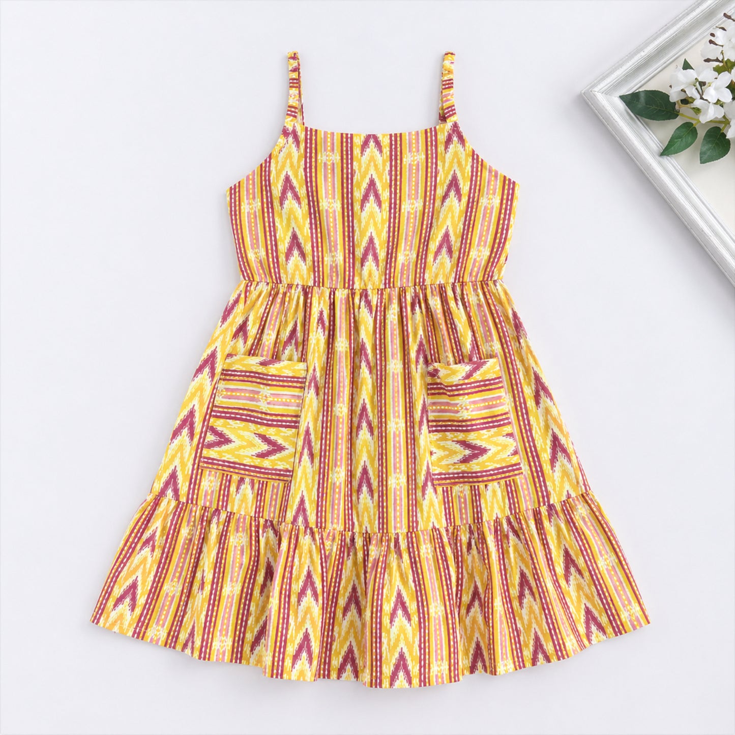 The Magic Wand Cotton Woven Strappy Ikat Printed Gathered Dress With Patch Pockets  - Yellow