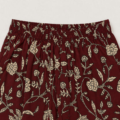 The Magic Wand Cambric Cotton Woven Sleeveless Floral Printed Laced Kurti And Afghani Pant Set -Maroon