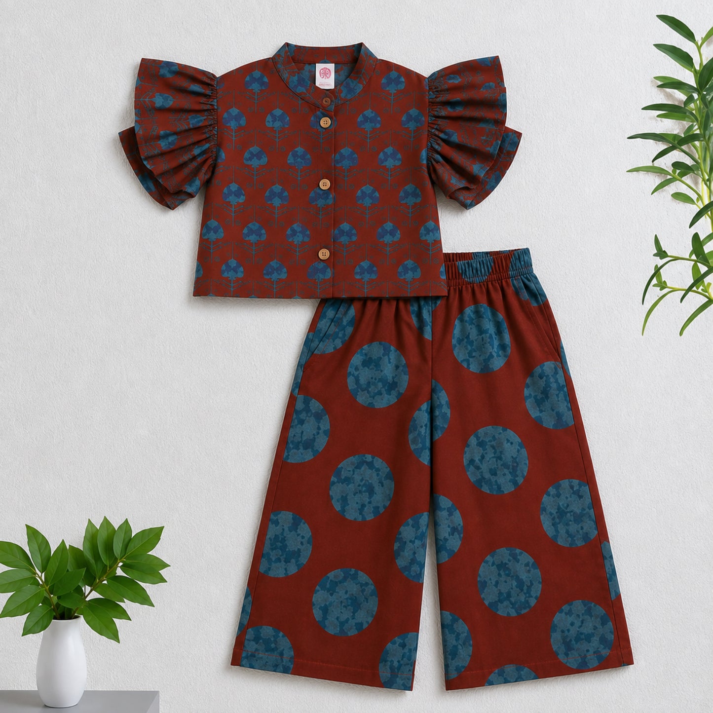 The Magic Wand Cambric Woven Ruffle Sleeves Tree Printed Crop Shirt And Oversized Polka Dots Pant Set - Rust