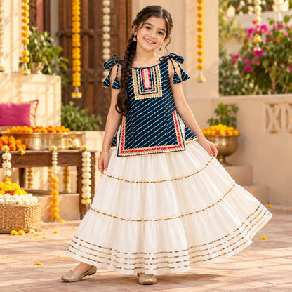 The Magic Wand Cotton Woven Cambric Leheriya Printed Laced And Tassel Detail Shoulder Tie-Up Kurti And Rayon Skirt Set - Navy Blue