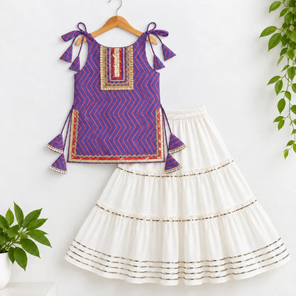 The Magic Wand Cotton Woven Cambric Zig Zag Printed Laced And Tassel Detail Shoulder Tie-Up Kurti And Rayon Skirt Set - Purple