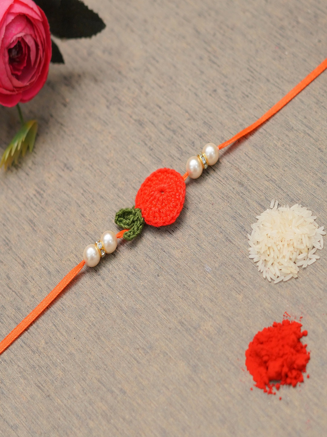 The Magic Wand Cute Fruit Applique Pearl Detailing Handmade Crochet Rakhi - Red
