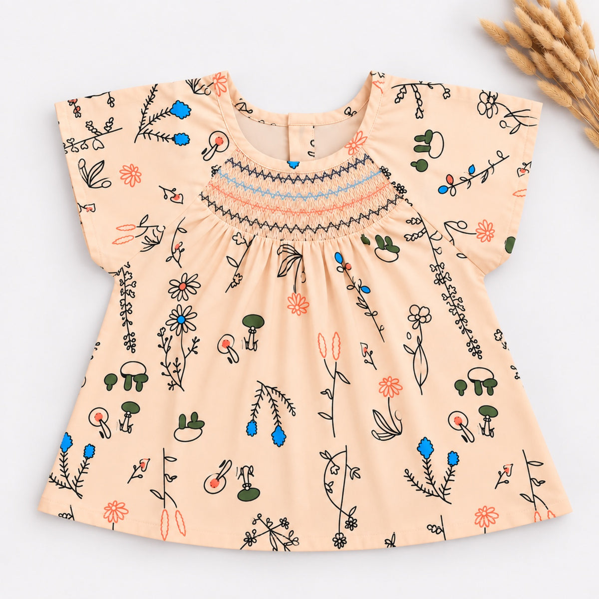 The Magic Wand Woven Cap Sleeves Botanical Printed Smocked Top- Peach