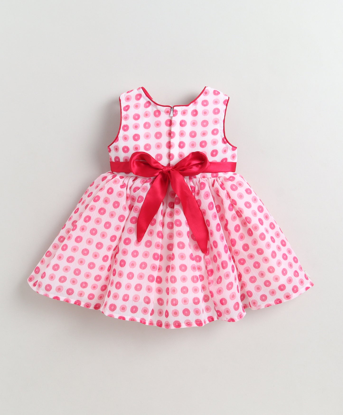 The Magic Wand Woven Sleeveless Polka Dots Printed Flared Dress With Floral Applique - Pink