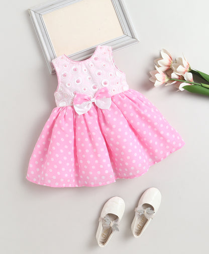 The Magic Wand Woven Sleeveless Polka Dot Pearl Embellished Flared Dress With Bow Applique - Pink