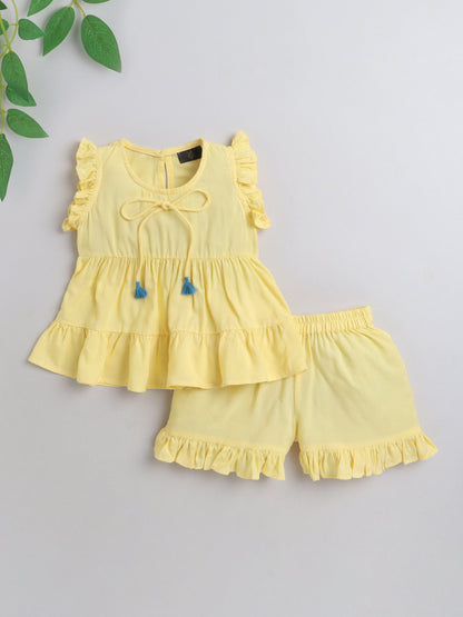 The Magic Wand Rayon Ruffled Sleeveless Solid Tassels Embelished Top With Shorts Yellow