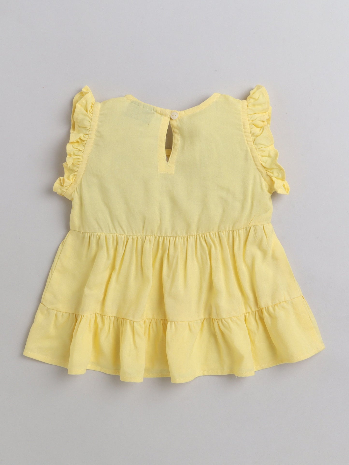 The Magic Wand Rayon Ruffled Sleeveless Solid Tassels Embelished Top With Shorts Yellow