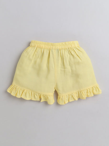 The Magic Wand Rayon Ruffled Sleeveless Solid Tassels Embelished Top With Shorts Yellow